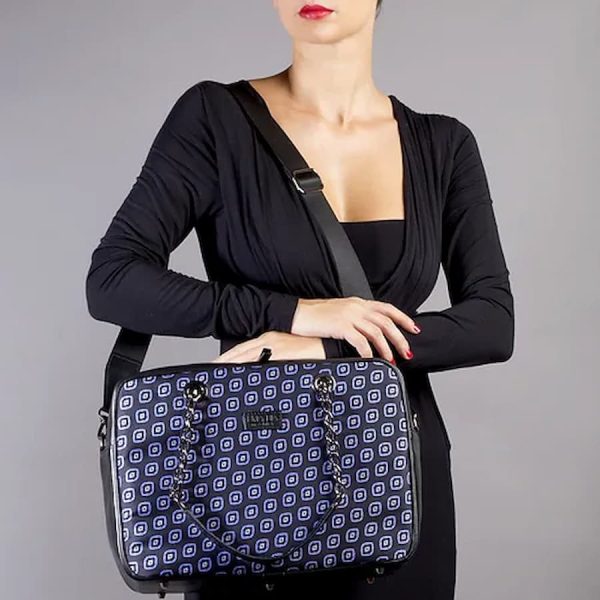 worn blue and black silk handbag with light blue print