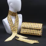 Kit Clutch pochette gialla con fiori stilizzati